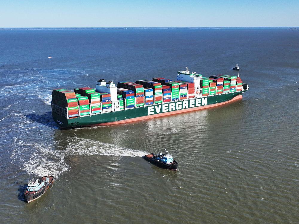 Tugboats pull on the Ever Forward near Pasadena, Md., on Tuesday, trying to free the ship as it sits in the Chesapeake Bay after running aground near Baltimore.