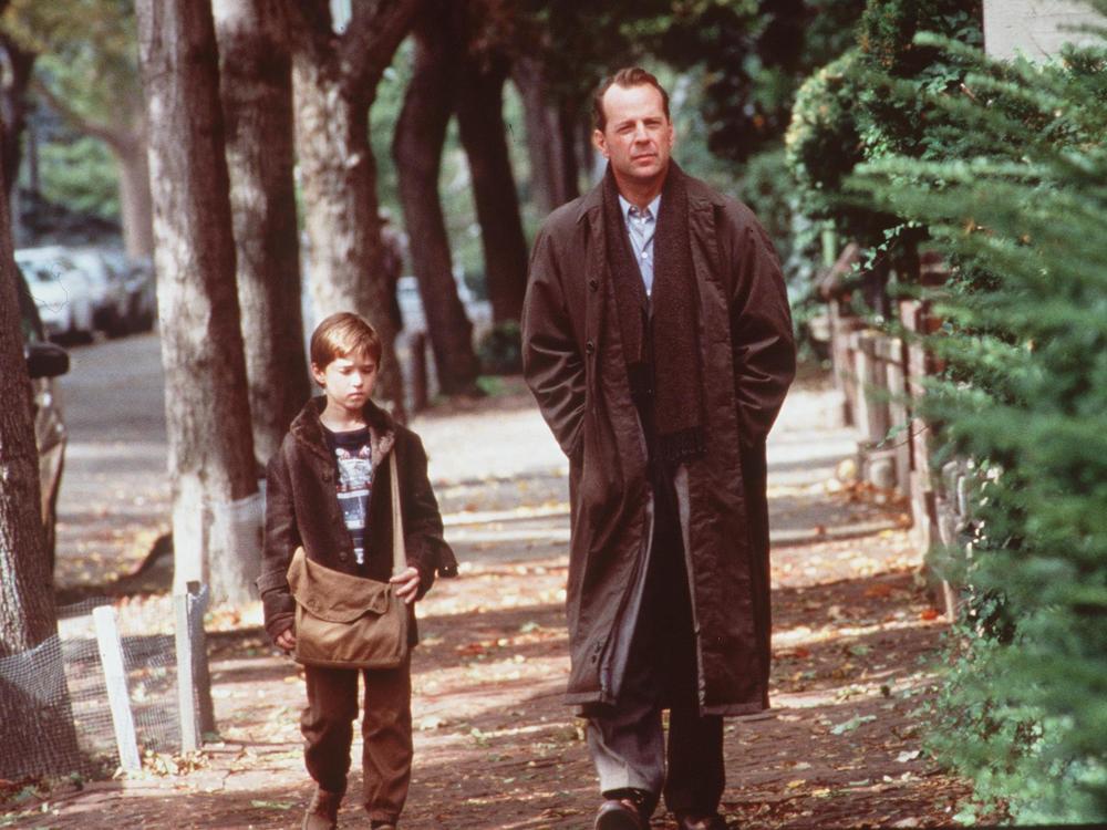 Haley Joel Osment And Bruce Willis in <em>The Sixth Sense</em> in 1999.