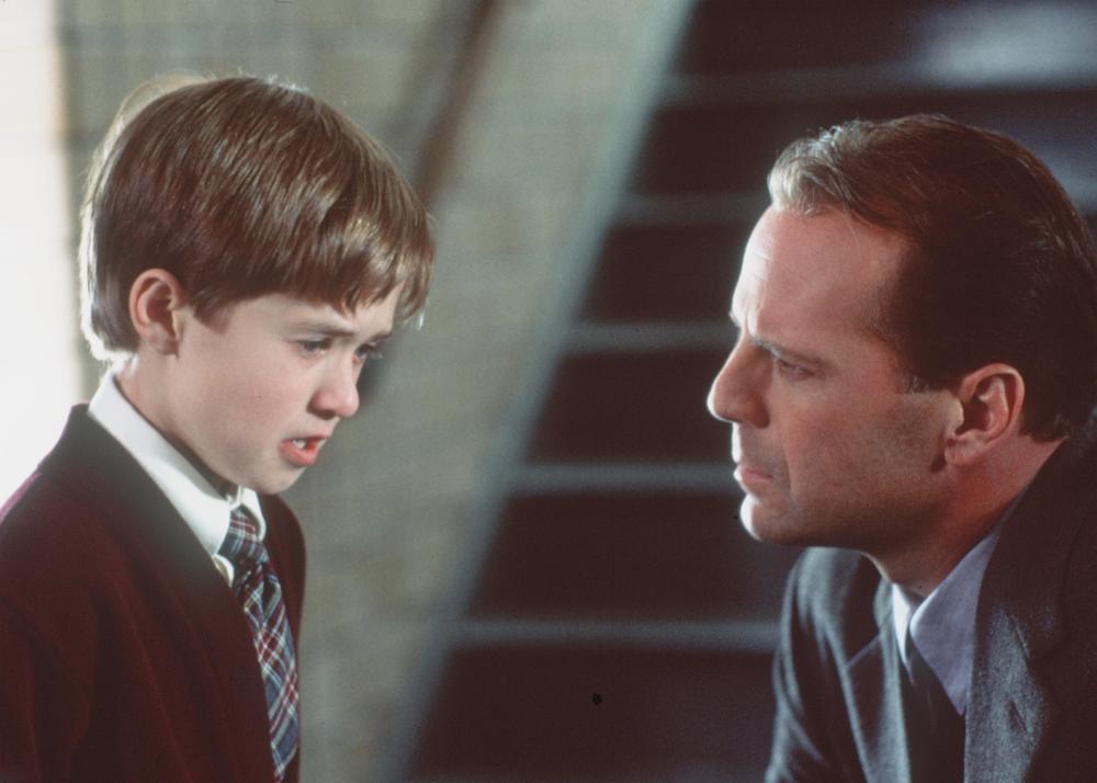 Haley Joel Osment and Bruce Willis in <em>The Sixth Sense</em>.