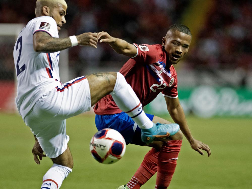 Costa Rica's Ian Lawrence (right) vies for the ball with U.S. player DeAndre Yedlin during their FIFA World Cup Qatar 2022 CONCACAF qualifier match in San Jose, Costa Rica, on Wednesday.
