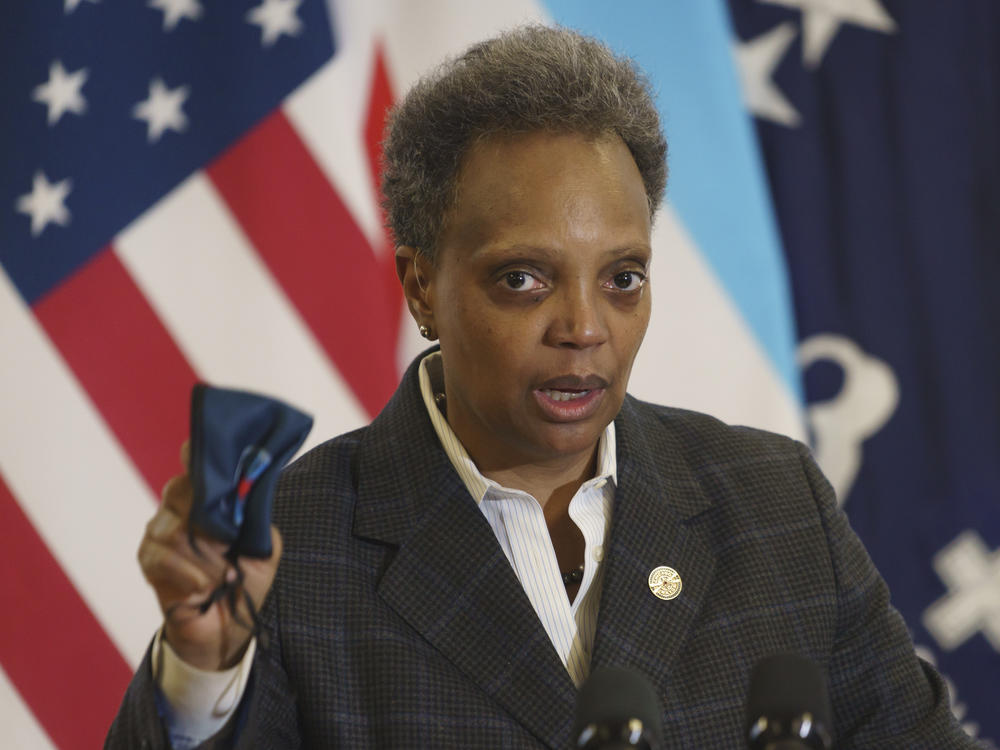 Mayor Lori Lightfoot emphasizes the importance of wearing a mask as she provides an update about the COVID-19 vaccinations at Norwegian American Hospital in Chicago on Tuesday, Jan. 5, 2021.