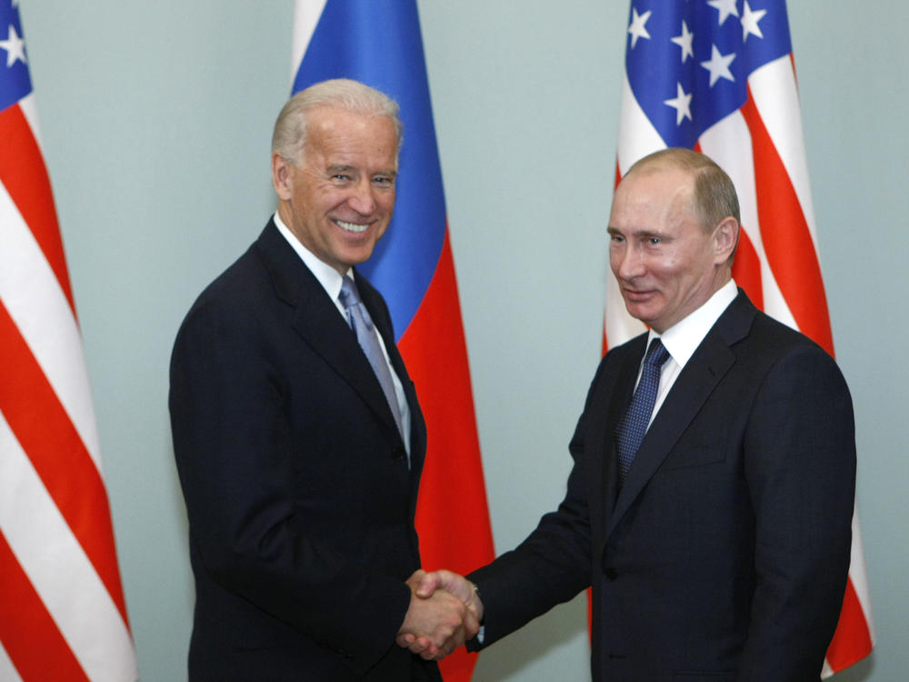 In this March 10, 2011 file photo, then-Vice President Joe Biden, left, shakes hands with Russian Prime Minister Vladimir Putin in Moscow, Russia.