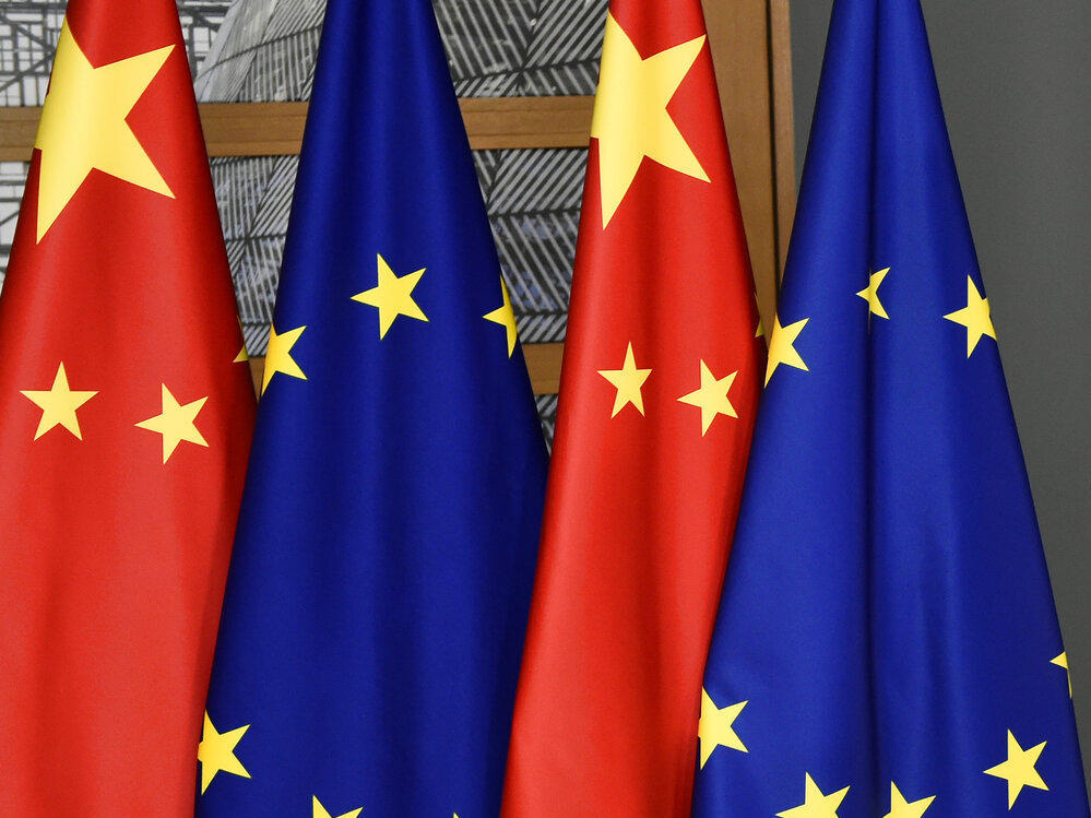 FILE - EU and Chinese flags are seen at the Europa building in Brussels, Tuesday, Dec. 17, 2019 (John Thys/Pool Photo via AP, File)