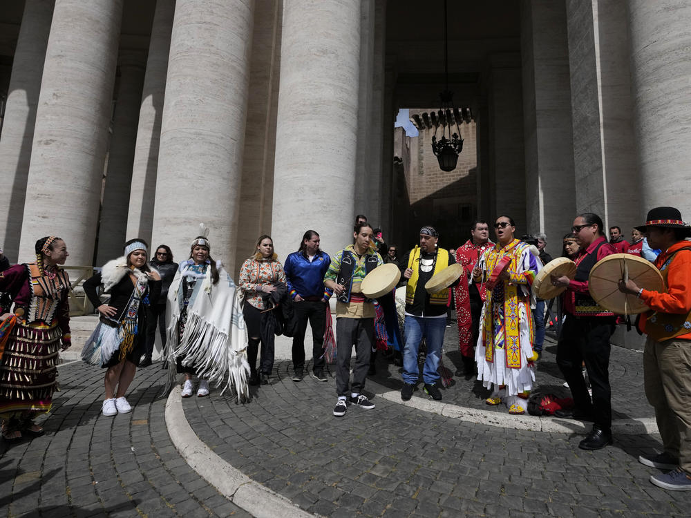 Indigenous artists from across Canada perform in St.Peter's Square, at the Vatican, on Friday after Pope Francis apologized for the Catholic Church's actions in Canadian residential schools.