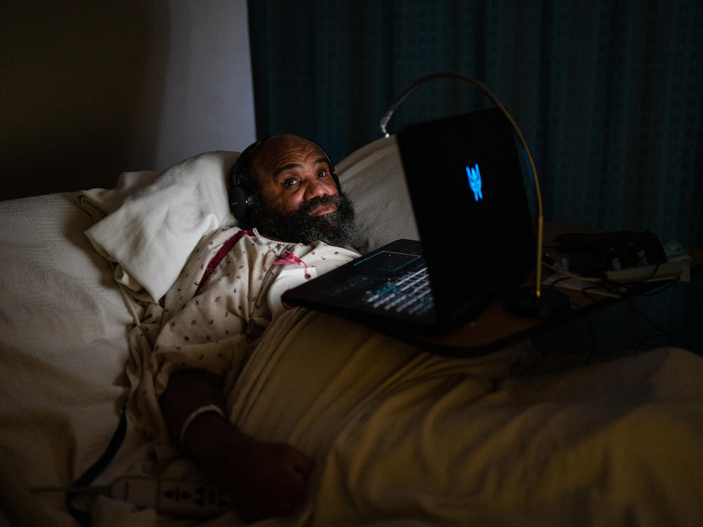 Maurice Miller lies in bed in his room at a nursing home in Takoma Park, Md., on Thursday. The Biden administration is planning to establish a federal minimum staffing requirement for nursing homes as part of a broader push to improve care for seniors and people with disabilities.