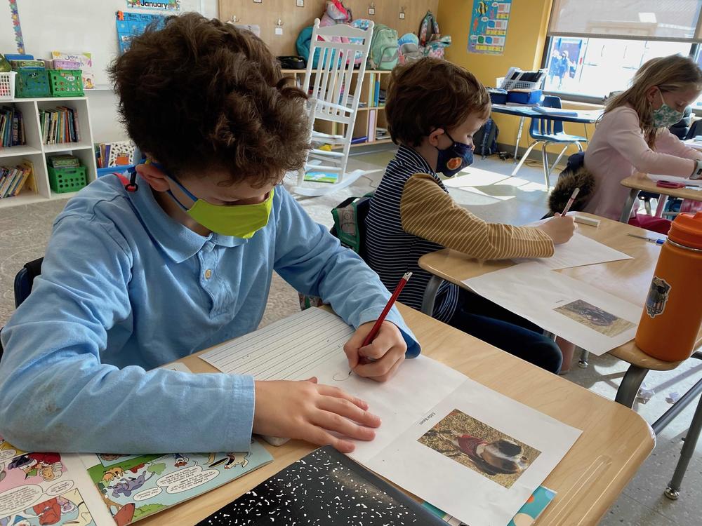 Students write the letters.