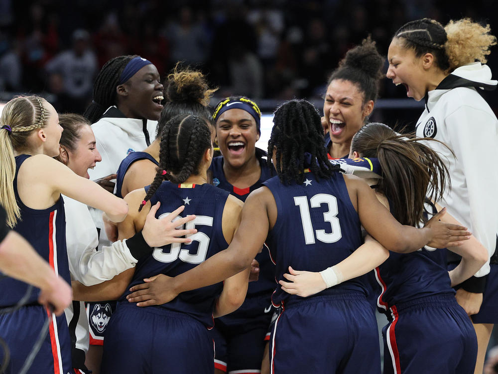 The UConn Huskies celebrate after defeating the Stanford Cardinal 63-58 during the 2022 NCAA Women's Final Four semifinal game Friday at Target Center in Minneapolis.