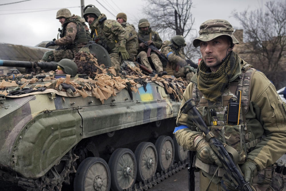 <strong>April 2:</strong> A Ukrainian serviceman walks next to a fighting vehicle outside Kyiv.