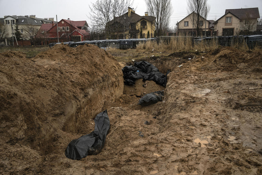 <strong>April 3:</strong> A mass grave in Bucha, on the outskirts of Kyiv. Ukrainian troops have found brutalized bodies and widespread destruction in the suburbs of Kyiv, sparking new calls for a war crimes investigation and new sanctions against Russia.