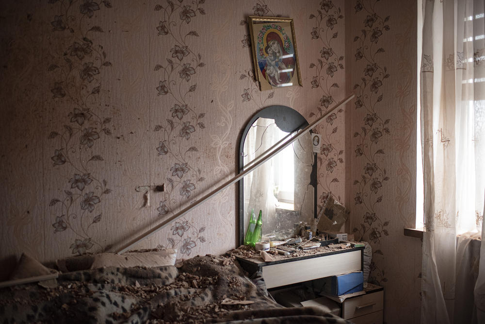 <strong>April 2:</strong> Rubble can be seen on a table and bed inside a house in Dmytrivka, a village in the Kyiv Oblast.