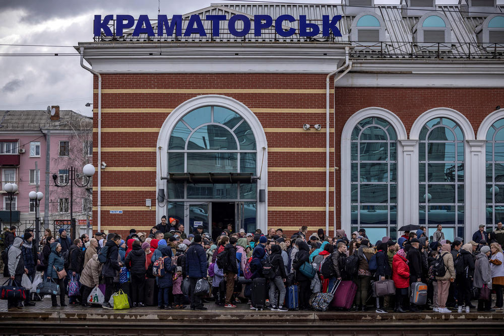 <strong>April 3:</strong> Families arrive at the main train station as they flee the eastern city of Kramatorsk, in the Donbas region.