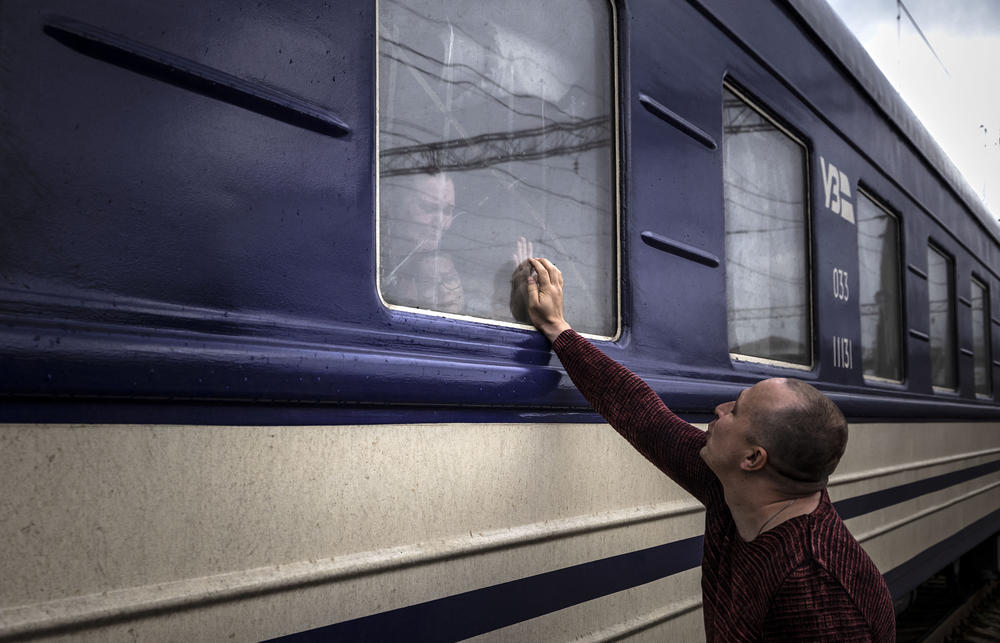<strong>April 3:</strong> A man says goodbye before the train leaves the eastern city of Kramatorsk, in the Donbas region.