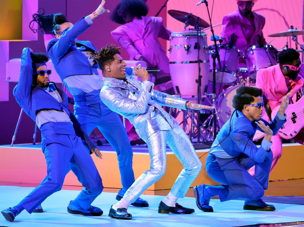 Jon Batiste (center) performs at the 64th annual Grammy Awards on April 3, 2022. Batiste was nominated in 11 categories and took home five prizes, including album of the year.
