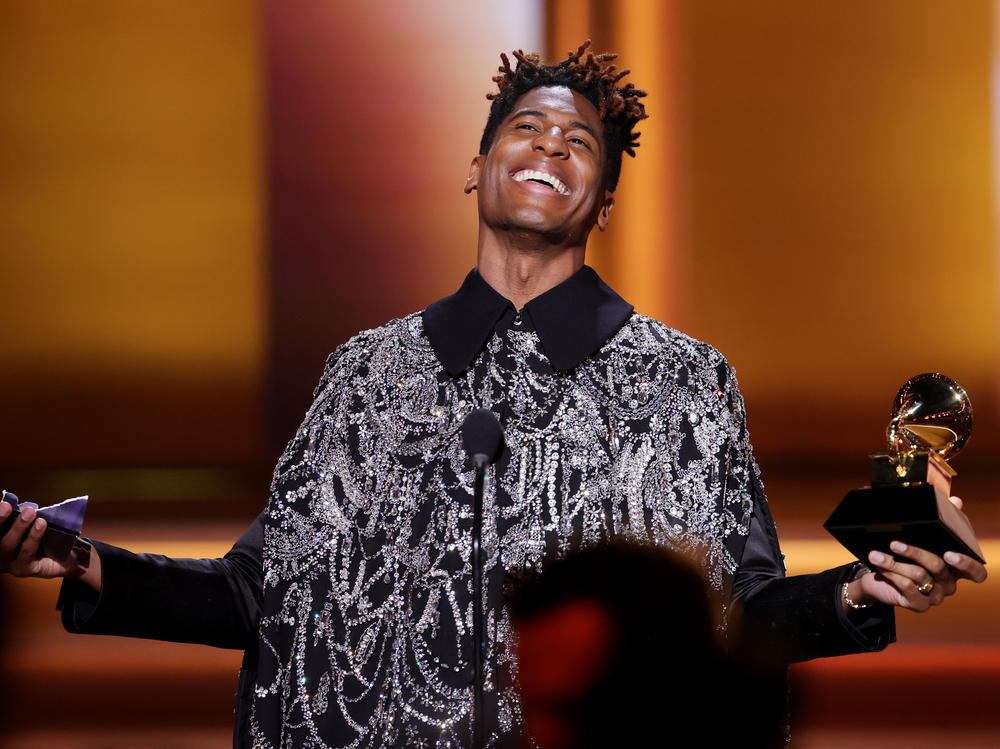 Jon Batiste accepts the Grammy for album of the year at the 64th annual Grammy Awards, presented Sunday, April 3 in Las Vegas. Batiste was the night's biggest winner by the numbers, with five awards including the night's final honor.