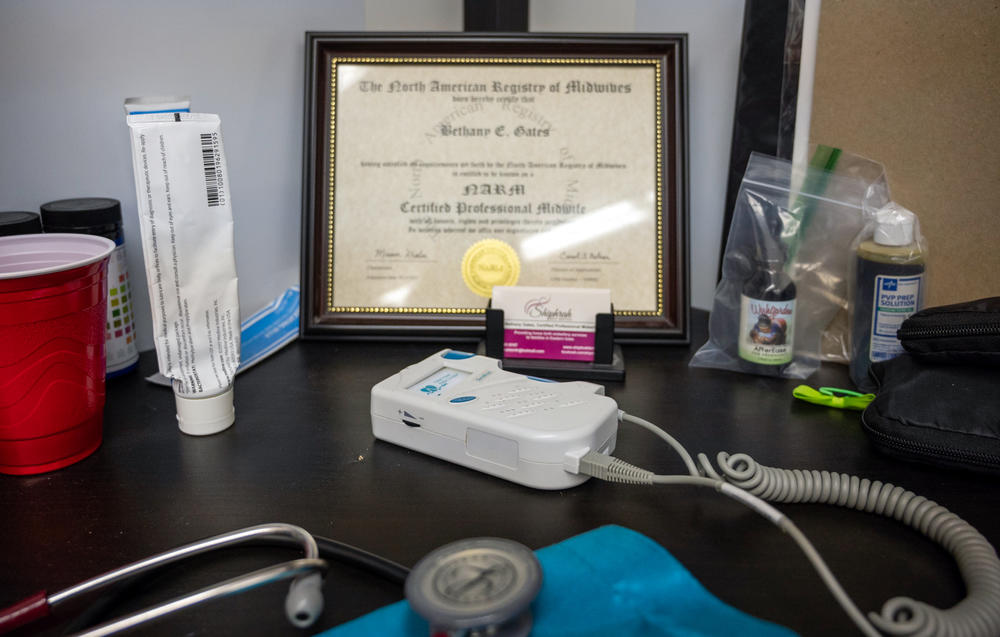 Bethany Gates' desk contains her certification from the North American Registry of Midwives, the organization that approves courses for certified professional midwives.