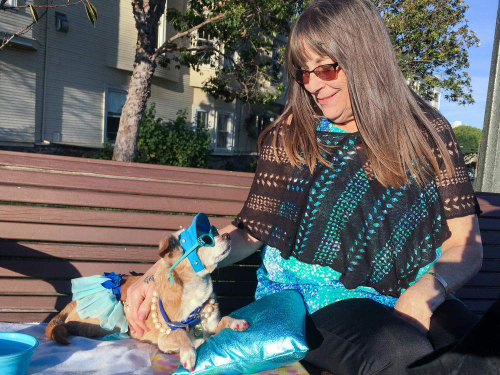 Diana McAllister takes her dog, Honey, to a park in San Francisco, where some owners have had to wait months to get veterinarian appointments.