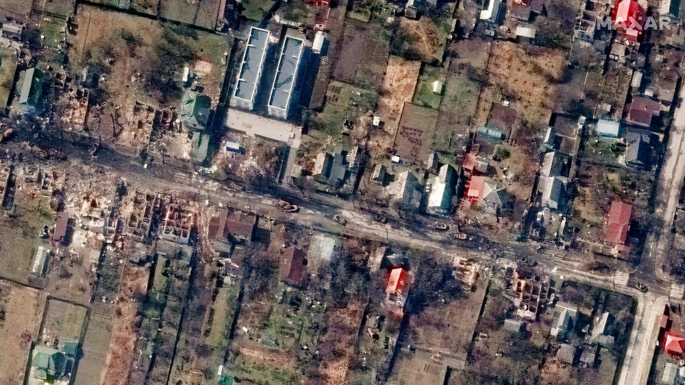 Satellite imagery from March 31 shows destruction along Vokzal'na Street in Bucha, 14 miles from downtown Kyiv. Charred remains of tanks and cars are visible along with widespread building damage.