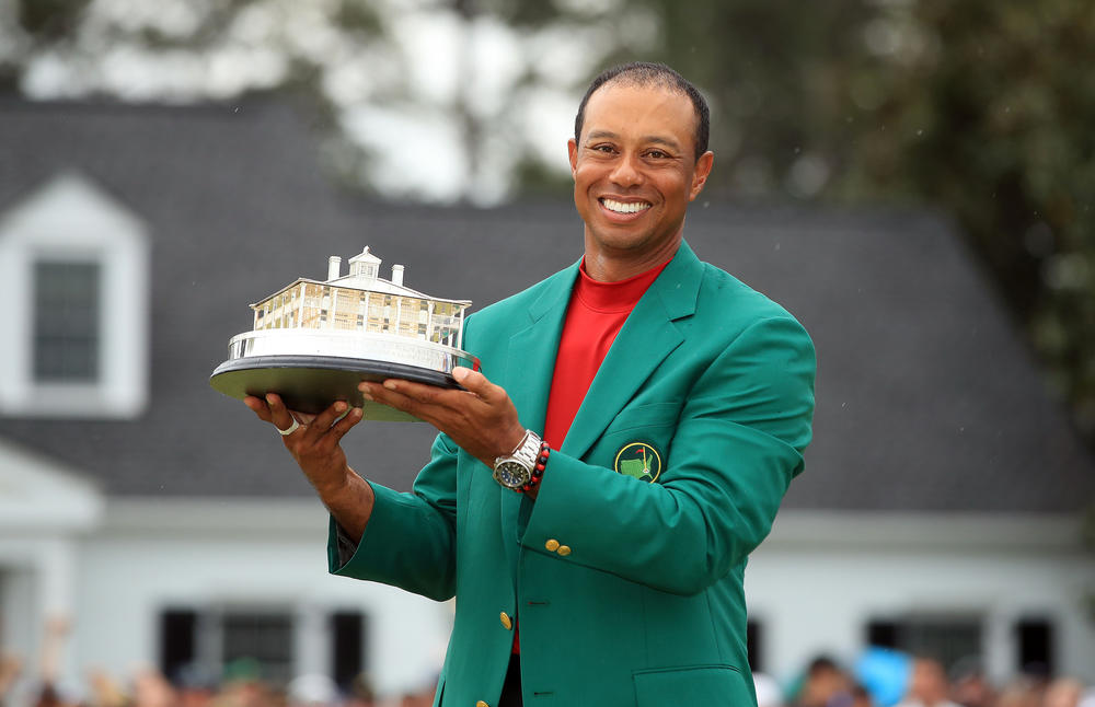Tiger Woods celebrates with the Masters trophy during the Green Jacket Ceremony after winning the Masters in 2019.