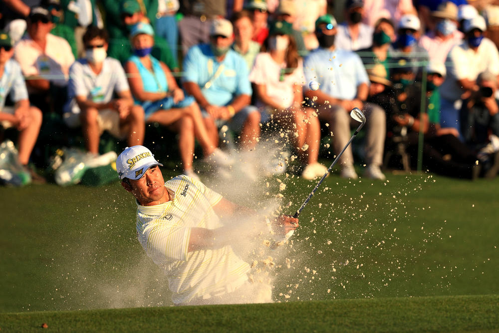 Hideki Matsuyama plays a shot from a bunker on the 18th hole during the final round of the Masters on April 11, 2021.