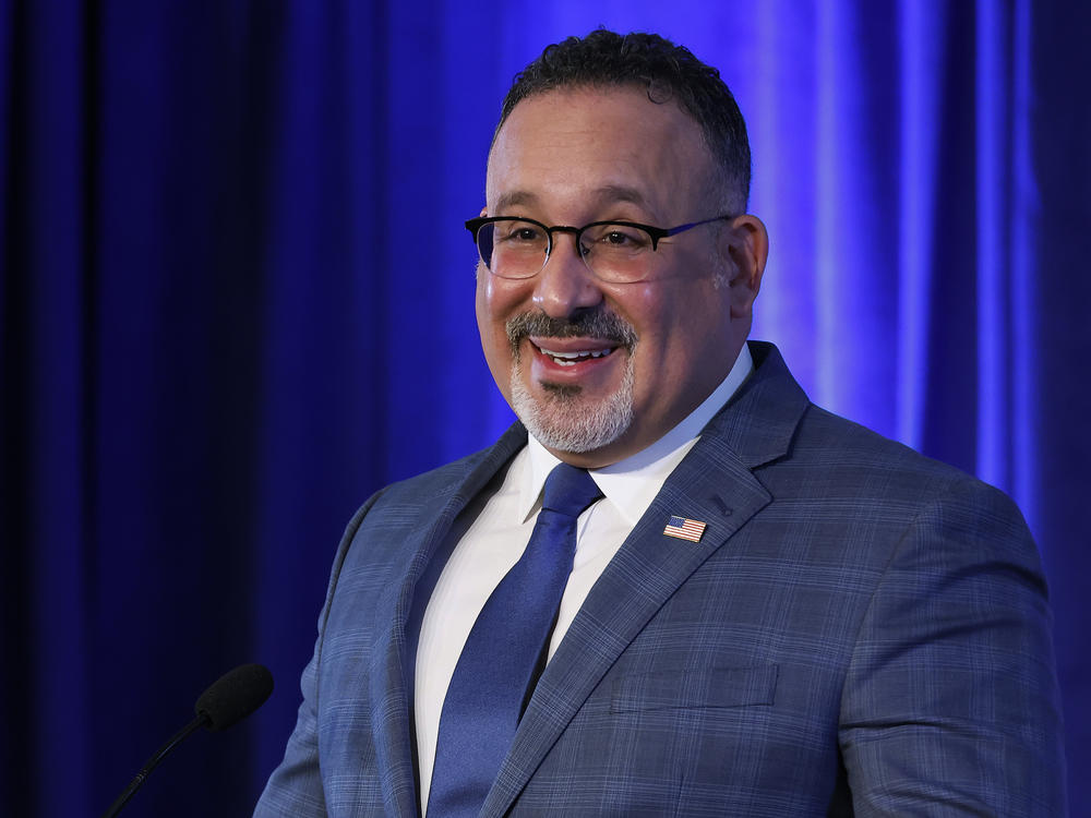 U.S. Education Secretary Miguel Cardona delivers remarks in Washington, D.C., in January. The department has extended the freeze on federal student loan payments several times since the pandemic began in March 2020.