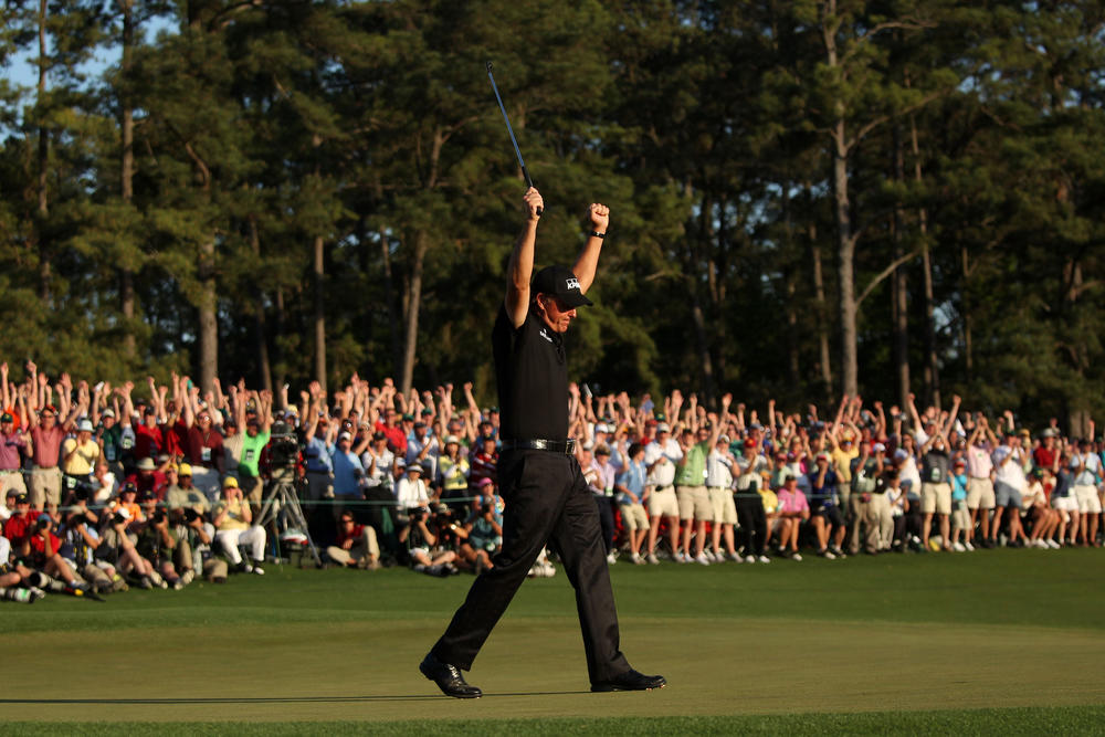 Phil Mickelson celebrates his three-stroke victory after winning the 2010 Masters Tournament.