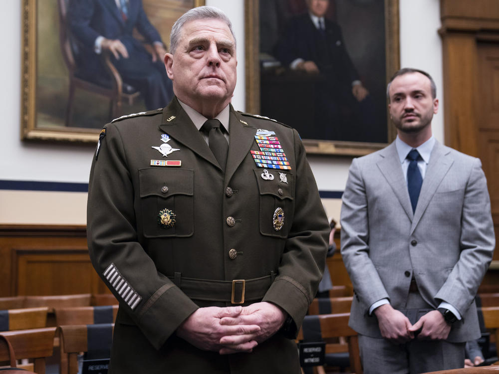 Chairman of the Joint Chiefs of Staff Gen. Mark Milley, left, arrives for a House Armed Services Committee hearing on the fiscal year 2023 defense budget on April 5, 2022, in Washington.