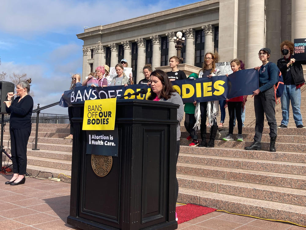 Emily Wales, interim CEO of Planned Parenthood Great Plains Votes, speaks to a group of abortion rights advocates outside the state Capitol in Oklahoma City on Tuesday. The Oklahoma House gave final legislative approval to a bill that would make performing an abortion a felony.