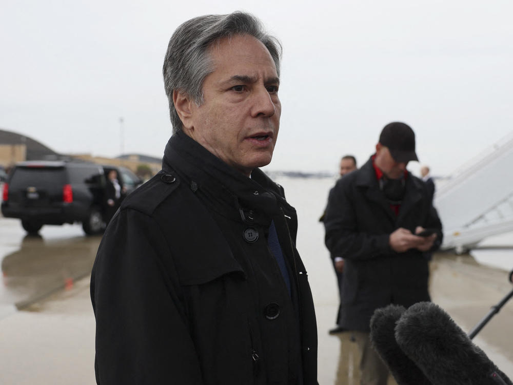 U.S. Secretary of State Antony Blinken speaks to members of the media, before departing for Brussels from Joint Base Andrews, in Maryland, on Tuesday.