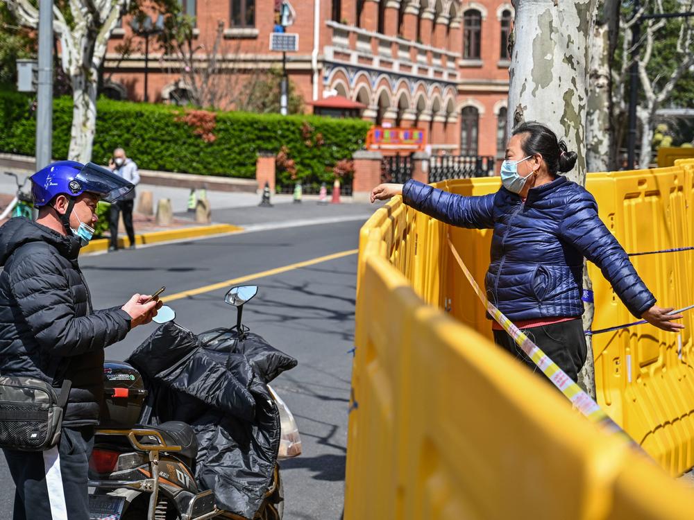 Neighborhoods are separated by barriers as part of lockdown measures in Shanghai to prevent the spread of the highly transmissible omicron variant.