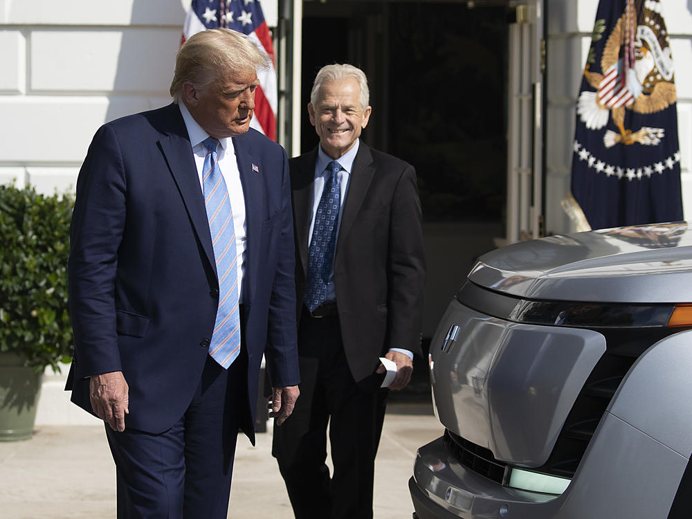 Then-President Donald Trump and former Trade Adviser Peter Navarro check out an Endurance all-electric pickup truck on the South Lawn of the White House on Sept. 28, 2020.