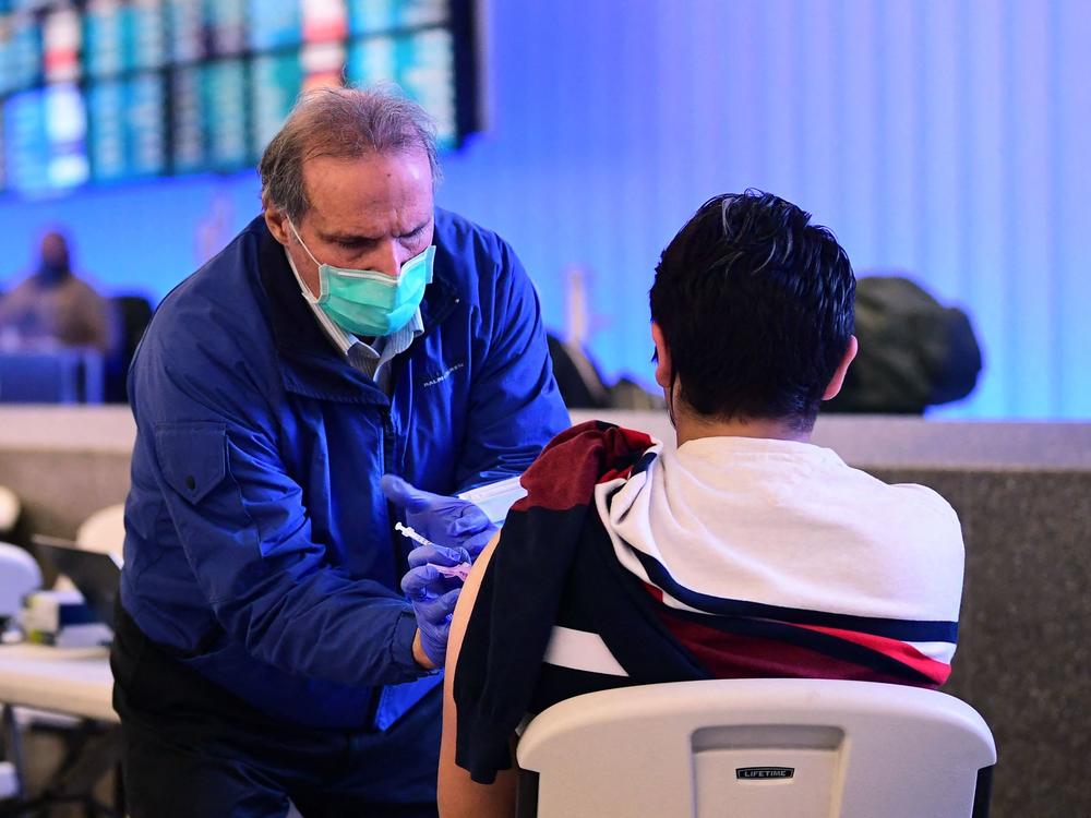 A pop-up clinic inside Los Angeles International Airport offered free vaccinations and boosters for holiday travelers last December. A new round of vaccinations may be needed before next winter.