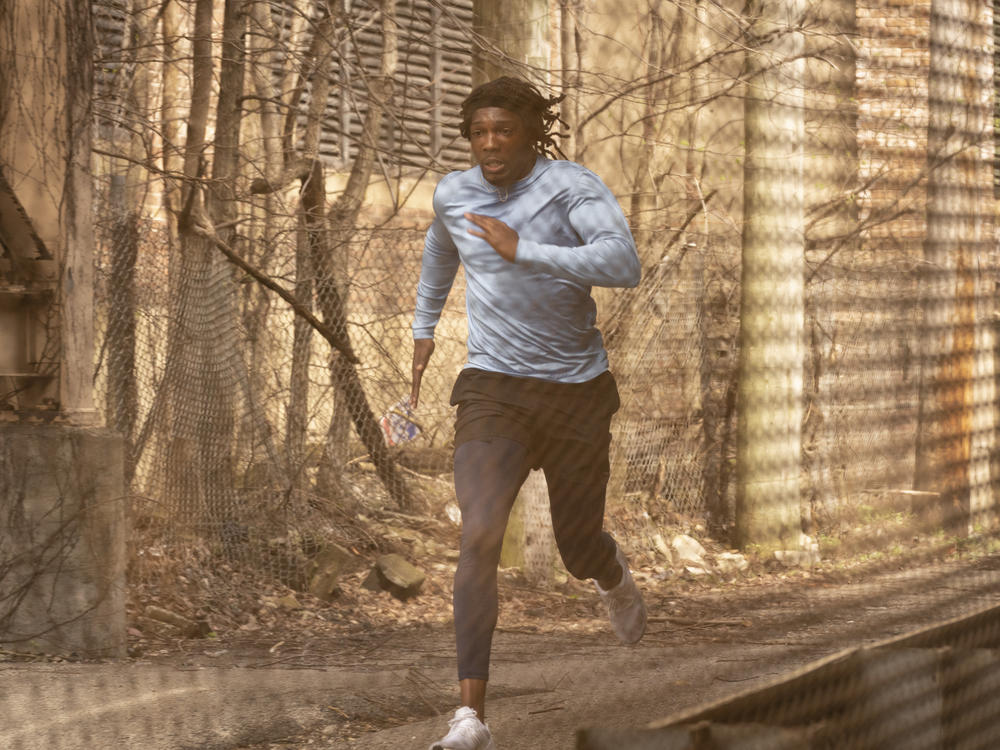 Track star Moses Johnson (Tosin Cole) ends up in the wrong place at the wrong time in the AMC series <em>61st Street.</em>