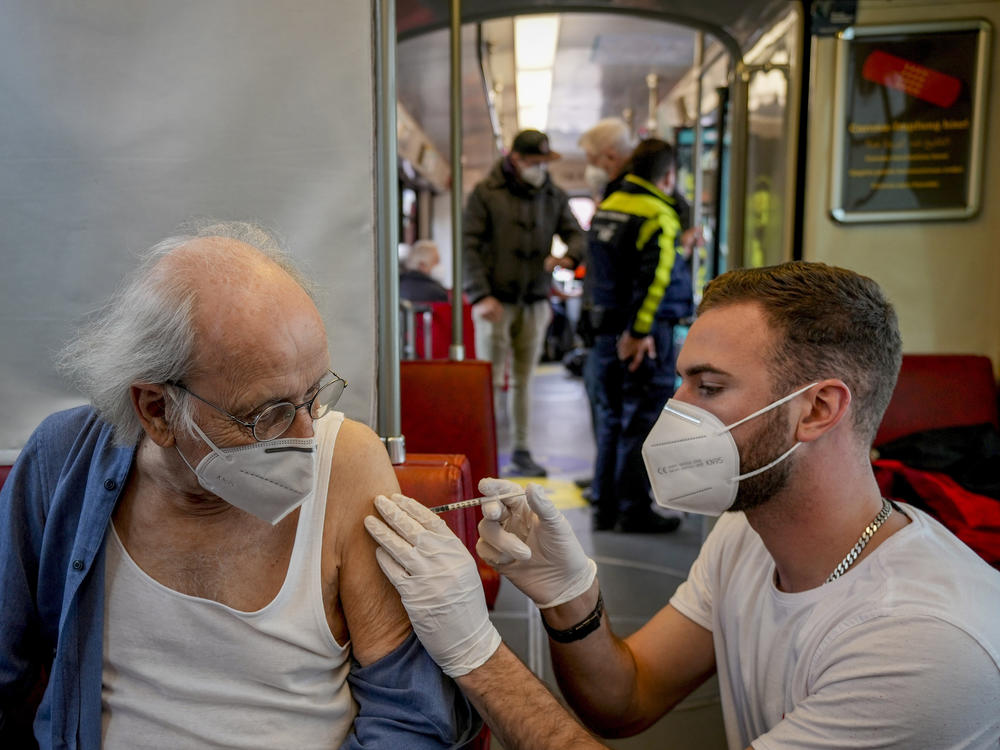 An 85-year-old man receives a booster vaccination in the so-called 