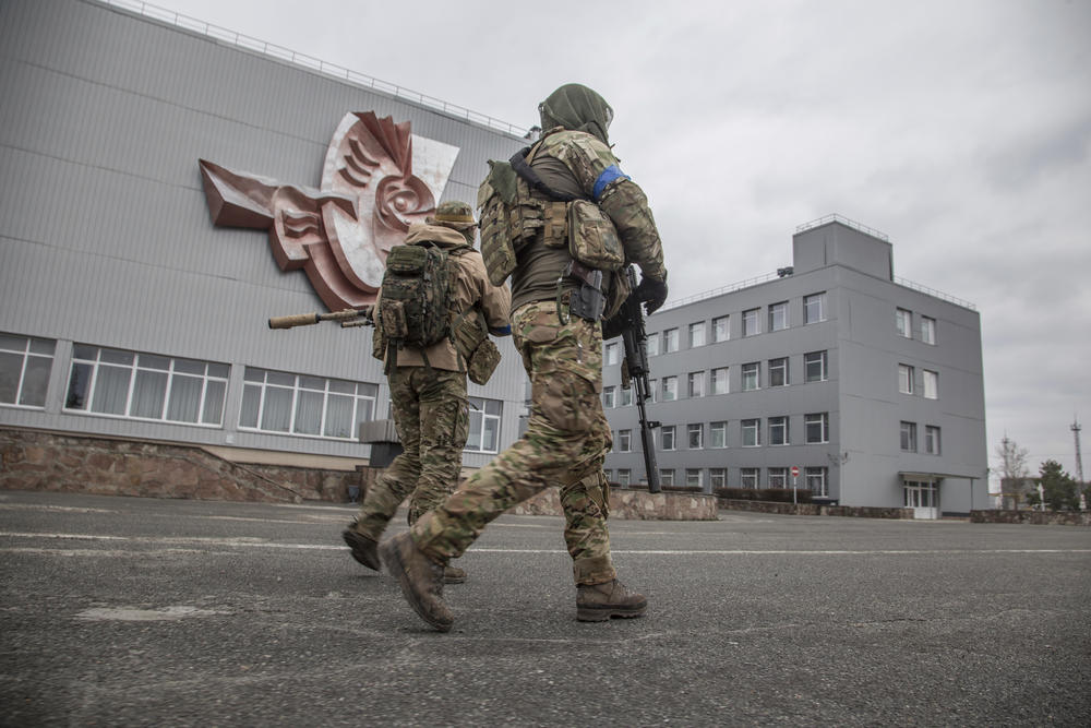 Ukrainian servicemen patrol the Chernobyl nuclear plant on April 5, 2022. Russia withdrew from the site just days earlier.