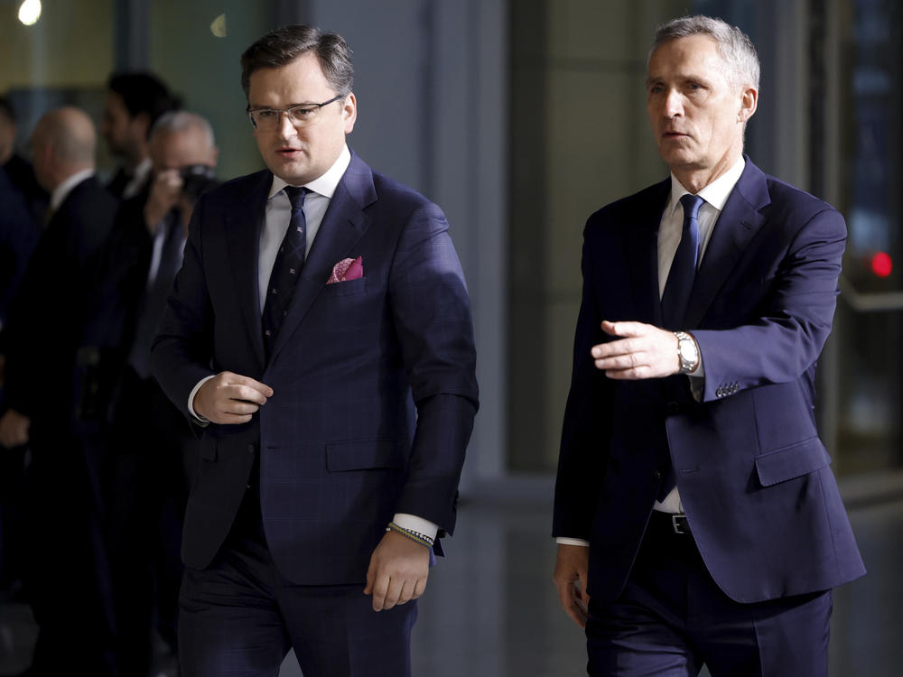 Ukraine's Foreign Minister Dmytro Kuleba, left, walks with NATO Secretary General Jens Stoltenberg as they arrive for a meeting of NATO foreign ministers at NATO headquarters in Brussels on Thursday.
