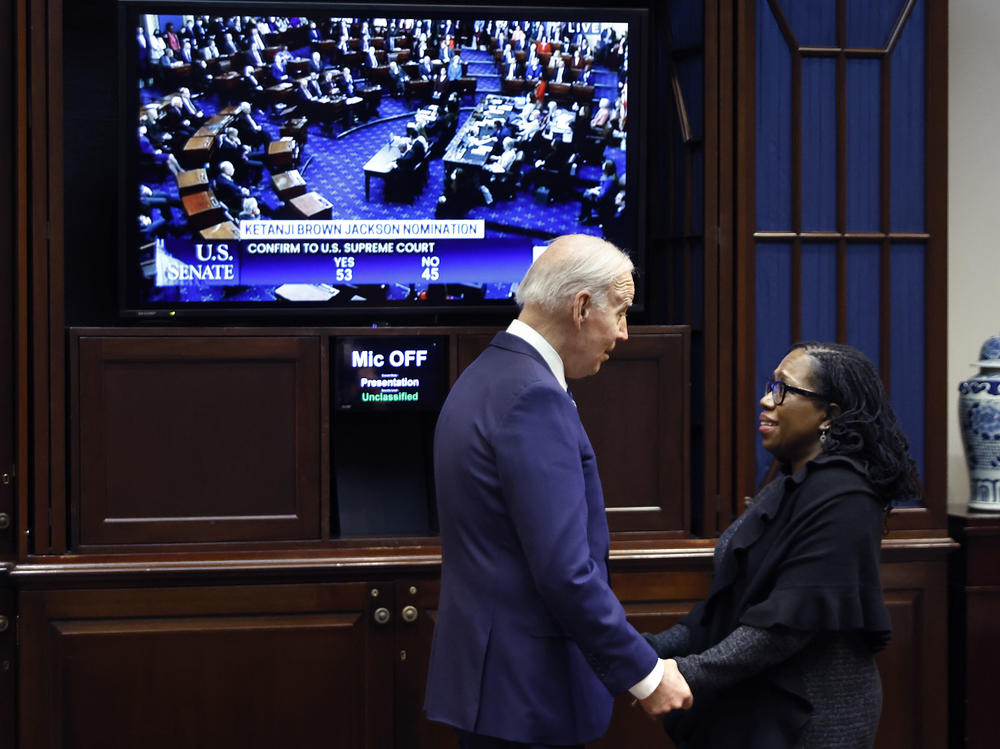 President Joe Biden congratulates Ketanji Brown Jackson moments after the Senate confirmed her to be the first Black woman to be a justice on the Supreme Court at the White House.