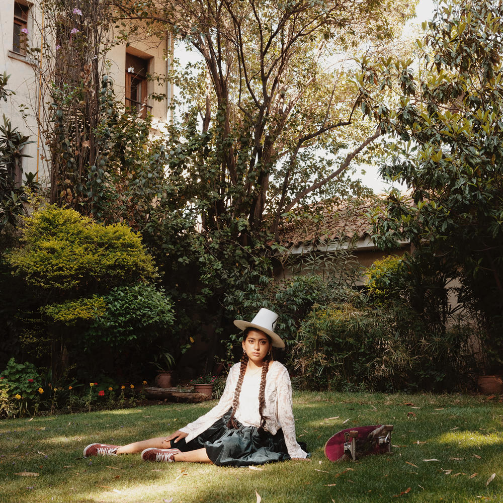 Ellinor Buitrago Méndez wears a <em>pollera</em> and a traditional hat. Fellow skater Medina says 