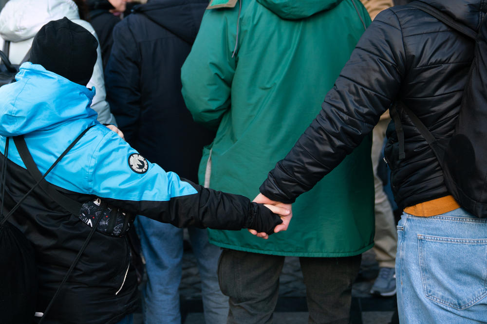 People gather as they're about to board a bus organized by Project Dynamo to leave Ukraine.