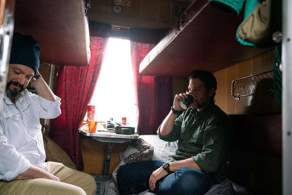 Bryan Stern (left) and Brett Velicovich of Project Dynamo wake up in the morning last month on an overnight train to Kyiv, the Ukrainian capital, to work on evacuations to get people out of danger.