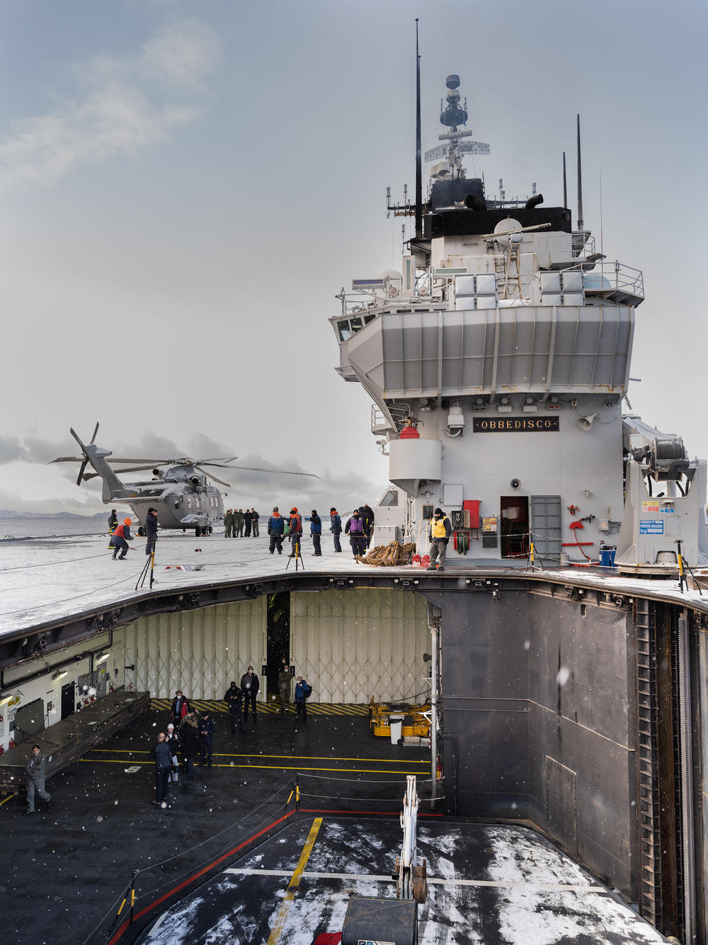 Italian aircraft carrier <em>Giuseppe Garibaldi,</em> with its flight deck elevator lowered, sailing in a Norwegian fjord above the Artic Circle. <em>Obbedisco</em> - 