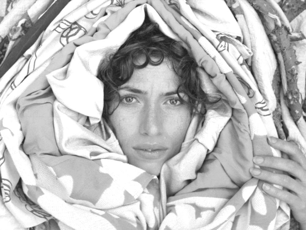 New Zealand songwriter Aldous Harding is a chameleonic presence on the new album <em>Warm Chris</em>, pulling off one mask only to reveal another.