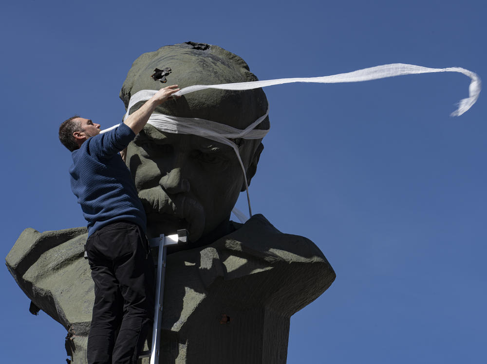 A monument for Taras Shevchenko is symbolically protected by bandages in Borodyanka, northwest of Kyiv.