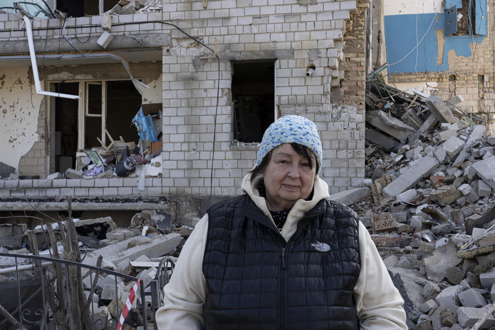 Ludmila Boiko near a collapsed building in Borodyanka.