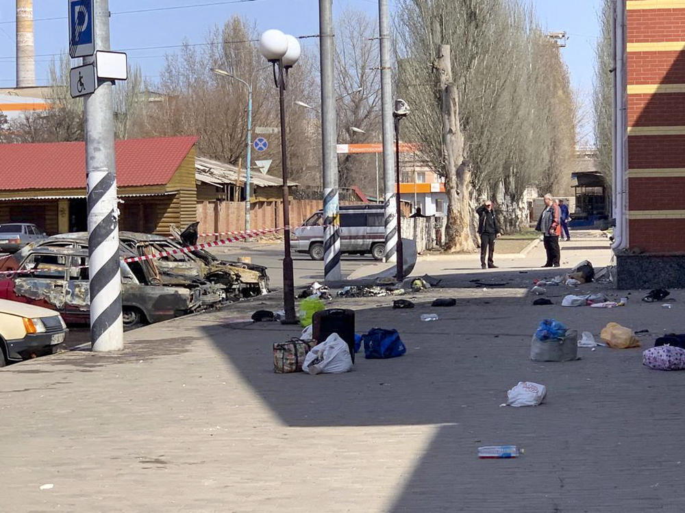 Personal belongings of victims and burned vehicles are seen after an alleged rocket attack Friday at the railway station in the eastern city of Kramatorsk, Ukraine.