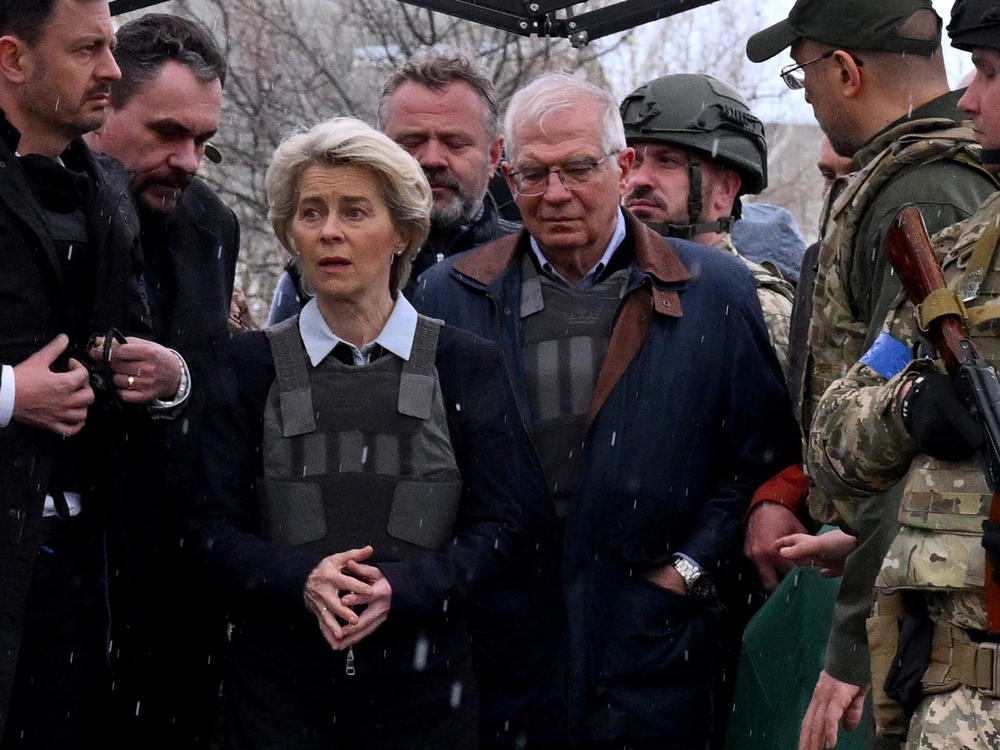 Slovakian Prime Minister Eduard Heger (left), European Commission President Ursula von der Leyen and European Union High Representative for Foreign Affairs and Security Policy Josep Borrell visit a mass grave in the town of Bucha on Friday.