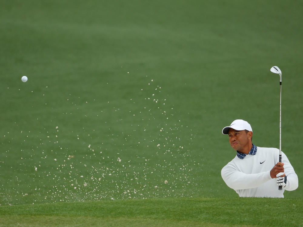 Tiger Woods plays his shot from the bunker on the second hole during the third round of the Masters at Augusta National Golf Club on Saturday.