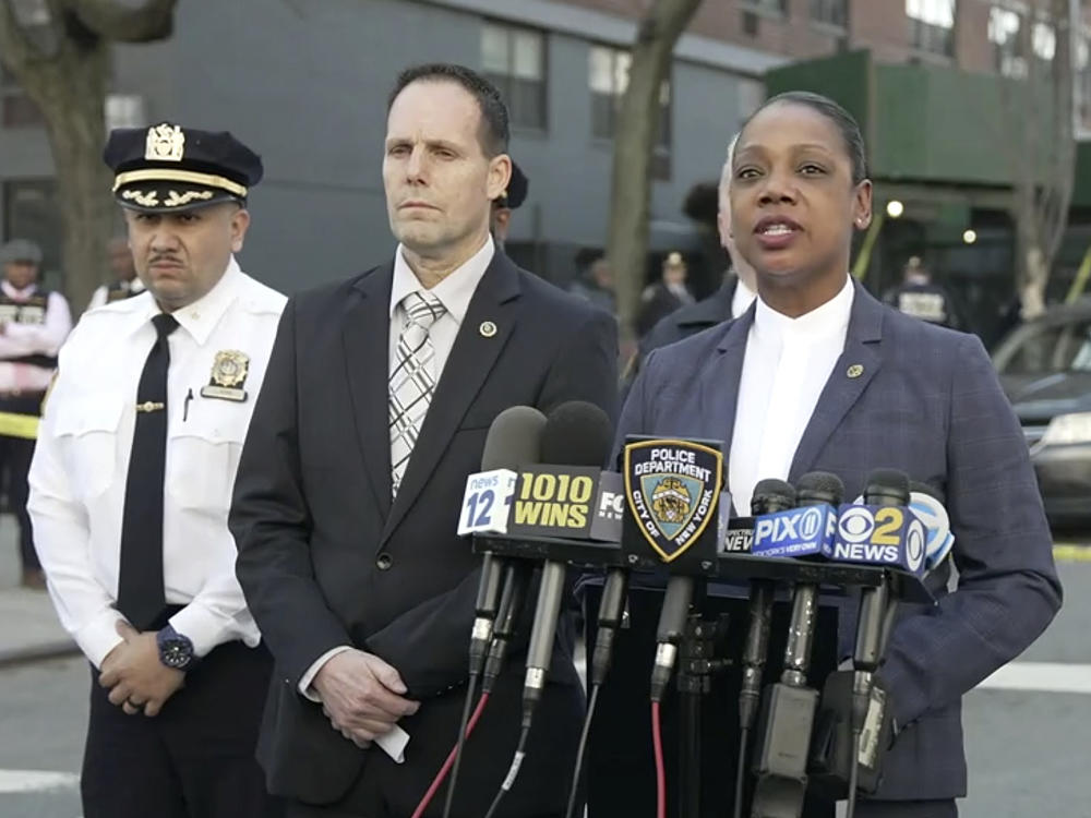In this image taken from video provided by the NYPD, New York Police Commissioner Keechant Sewel, right, speaks during a news conference, Friday, April 8, 2022, in New York.