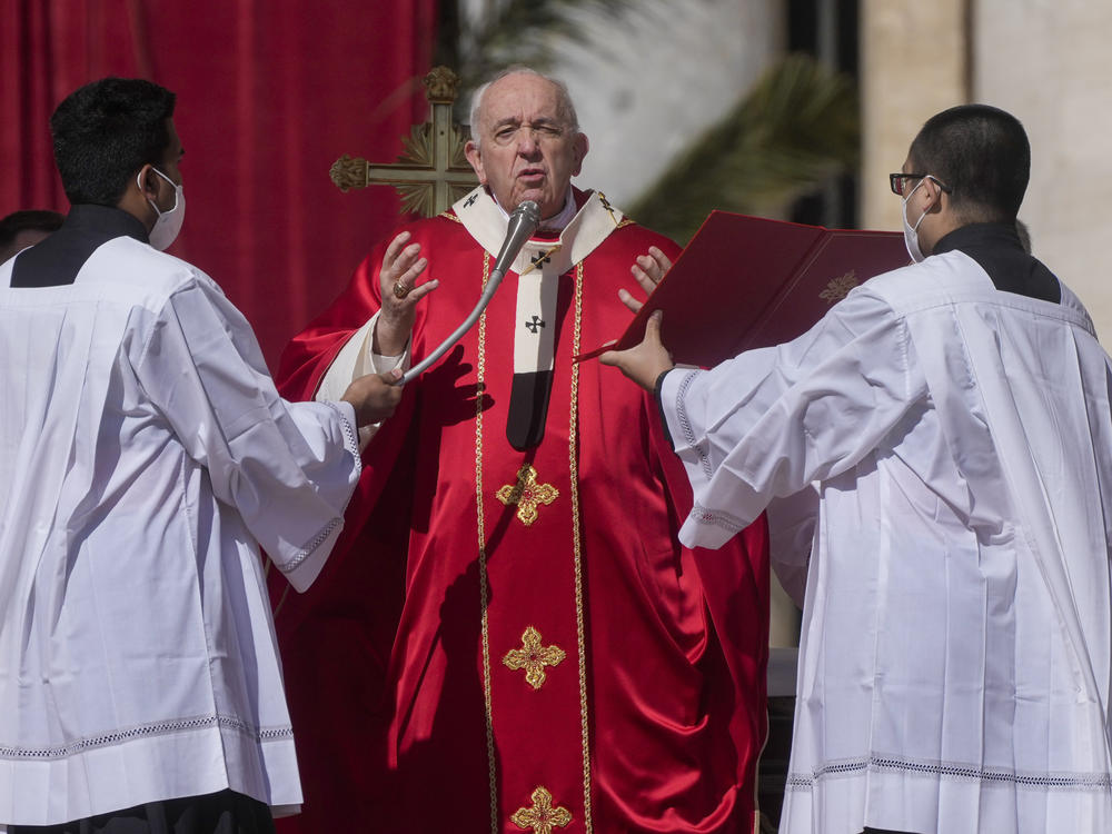 Pope Francis celebrates Palm Sunday Mass in St. Peter's Square at the Vatican.