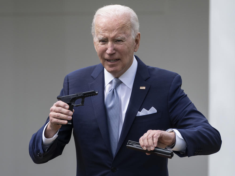 President Biden holds up a ghost gun kit during an event about gun violence in the Rose Garden of the White House on April 11, 2022 in Washington.