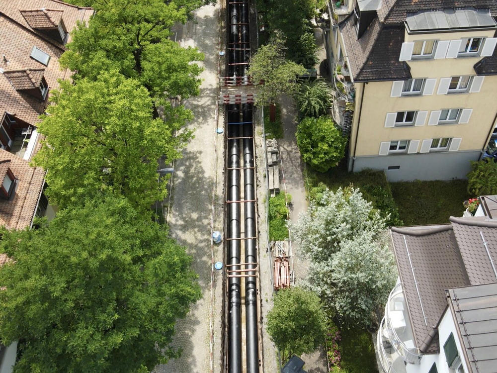 Zurich is expanding its district heating system, which delivers hot water and steam through underground pipes. With more buildings relying on this system for heat, there's less demand for natural gas.